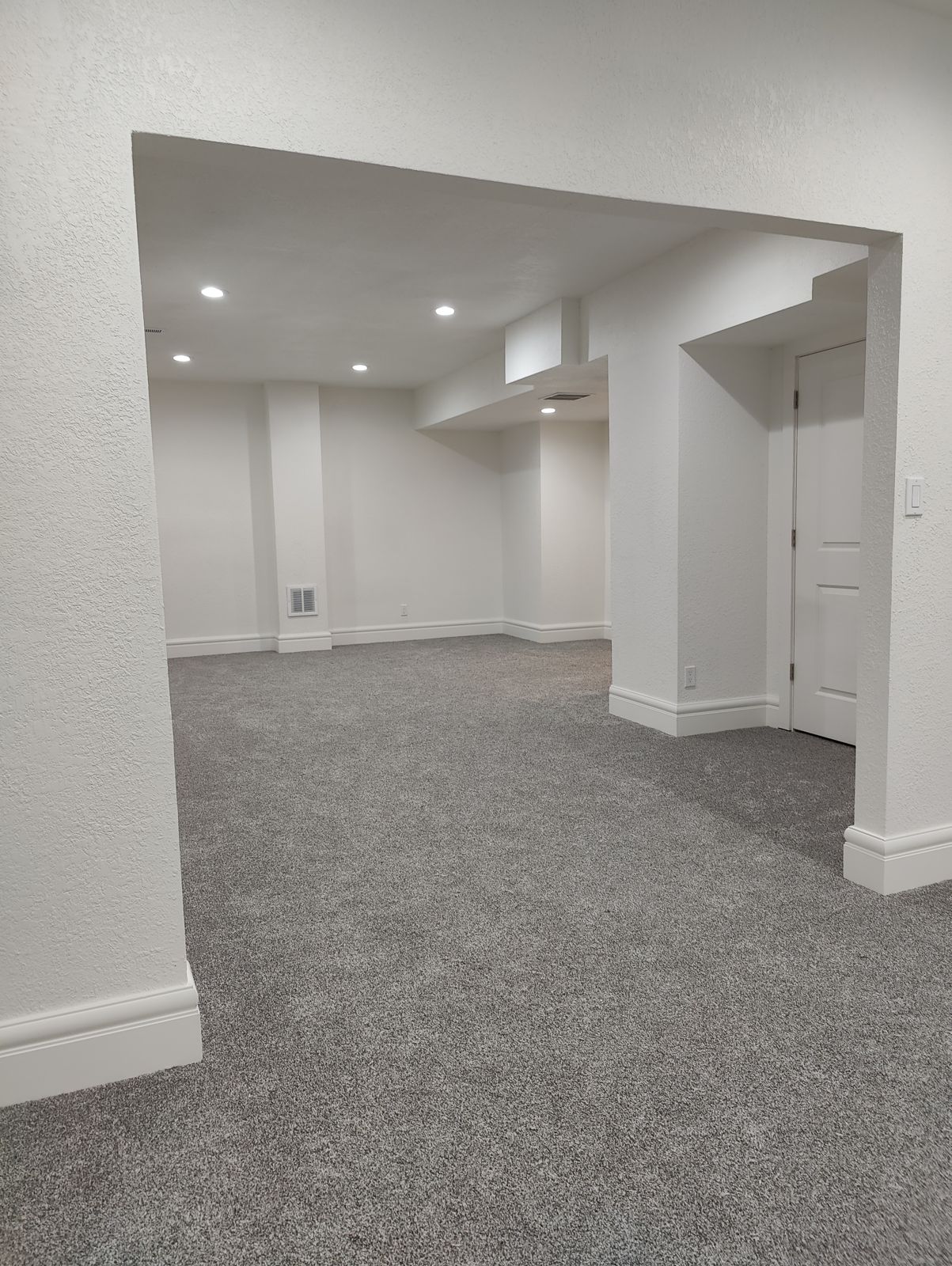 Finished basement with carpet in Thornton, CO